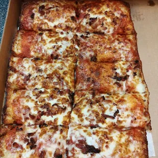 Bacon pizza. Missing sauce and cheese?