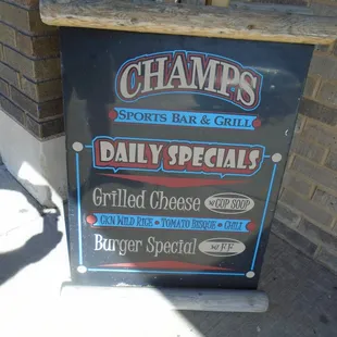 Placard sign on the sidewalk.