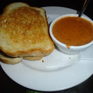 Bacon peanut butter burger with a side of tomato bisque soupl