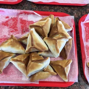 two trays of chinese dumplings