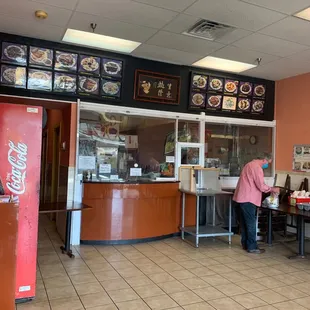 a woman standing in front of the counter