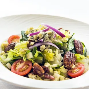 a salad in a white bowl