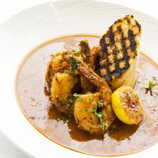 a plate of food with grilled shrimp