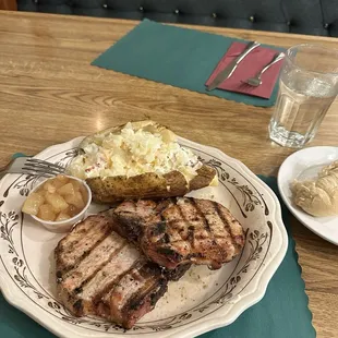 Pork chops with loaded potato.