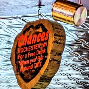 a hanging sign for a free drink