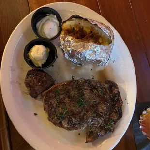 Ribeye with loaded baked potato