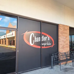 Sign on window. This restaurant is in a strip mall.