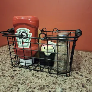 Condiment holder on table.