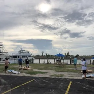 a group of people standing in a parking lot
