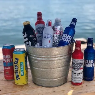 a bucket full of beer bottles