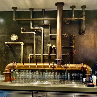 a bar with copper pipes