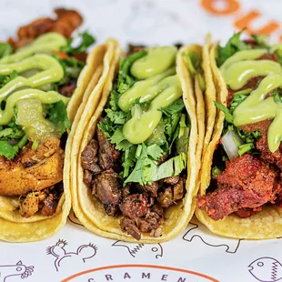 three tacoss on a plate