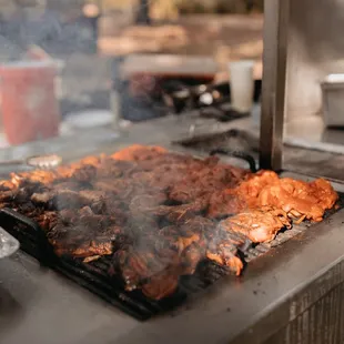 smoke coming out of a grill