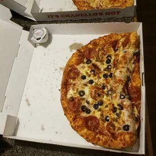 two slices of pizza in a box