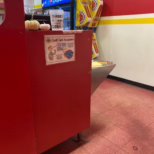 a red cart with pizzas on it