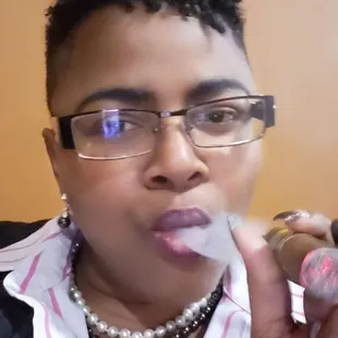 a woman smoking a cigar