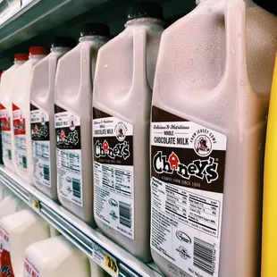 a row of milk jugs