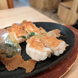 Shrimp dumplings with spicy sauce