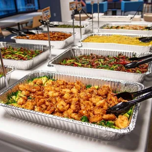 a variety of food items on a buffet table