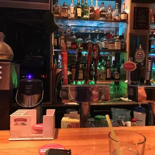 a bar with a variety of liquors