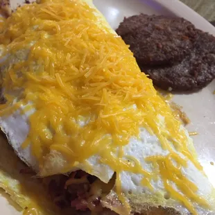 Bacon, mushroom, sausage and cheese omelette.