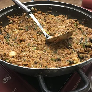 a pan of food with a spoon in it