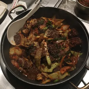 a stir fry with vegetables and meat