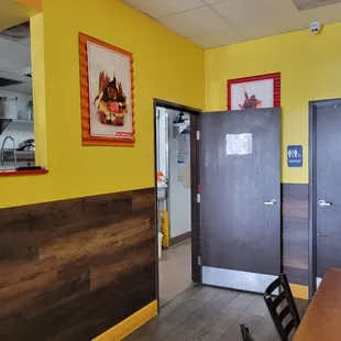 a dining room with a table and chairs