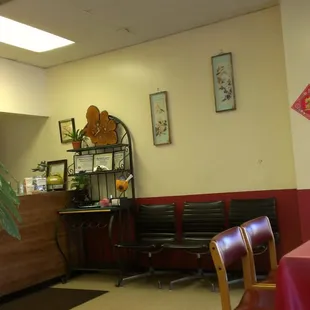 Counter where you place your order and pickup your food. Chairs rest next to counter to wait for pick up.