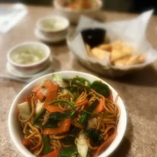 a bowl of noodles and vegetables
