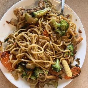a plate of noodles and vegetables
