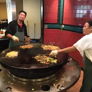 two men preparing food