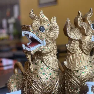 two golden dragon statues