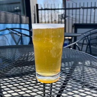 a glass of beer on a table
