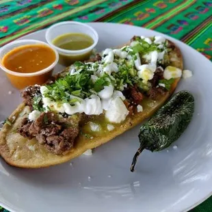 Huarache: Opcion de Carne, Frijoles, Cebolla, Cilantro, Queso, Crema, Salsa / Option of Meat, Beans, Onion, Cilantro, Cheese, Cream, Sauce