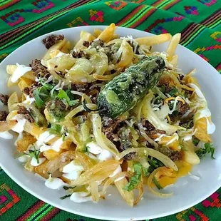 Papas Locas: Carne, Mayo, Crema, Queso, Cebolla, Cilantro, Salsa / Meat, Mayo, Cream, Cheese, Onion, Cilantro, Sauce