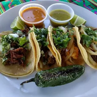 Tacos: Tortilla de Maiz, Opcion de Carne, Cebolla, Cilantrillo, Salsa / Corn Tortilla, Option of Meat, Onion, Cilantro, Salsa