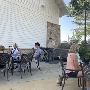 A lovely summer evening sipping wine on the patio listening to a fantastic pianist.