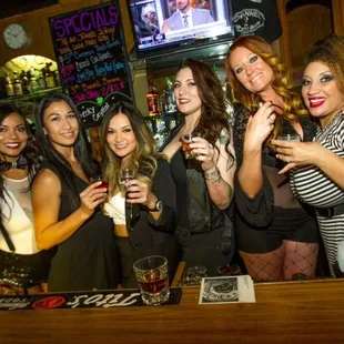 a group of women drinking beer