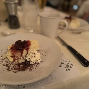 "Basque" cheesecake with wine cherry sauce. Mostly just plain, crustless cheesecake with sour cherries and a hint of alcohol left.