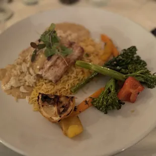 Tough, leathery and overcooked mahi mahi in a broken crab cream sauce?). Side of partly-cooked butter veggies. Saffron rice.