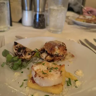 Appetizer of grits cake with grilled shrimp. Cheese scone with balsamic glaze and caramelized onions.