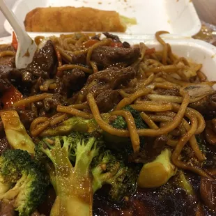 Beef and broccoli with an egg roll