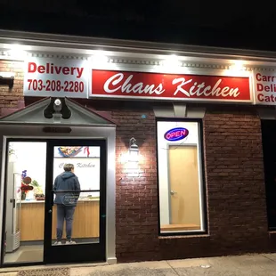 Exterior of Chan&apos;s Kitchen at night.