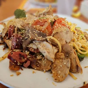 a plate of chicken and noodles