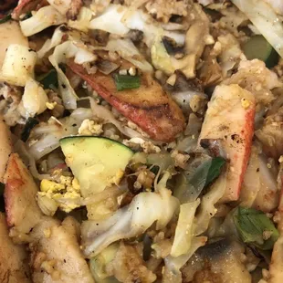 Tilapia, crab, zucchini, bean sprouts, cabbage, mushrooms, onions, and minced garlic. Added one egg, no rice - Delicious