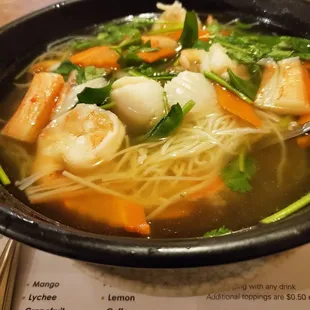 Seafood soup: shrimp, crab &amp; scallops with veggies over rice noodles