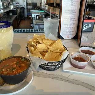 Classic Frozen Margarita $7.99, a cup of Caldo De Pollo $3.99, and complimentary Chips &amp; Salsa
