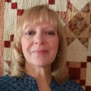 Crystal B.