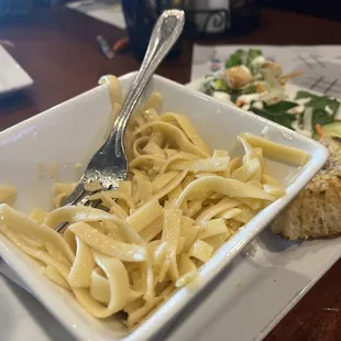 a plate of pasta and bread